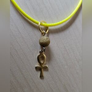Goldtone Ankh Pendant Aromatherapy Necklace with Yellow Cord